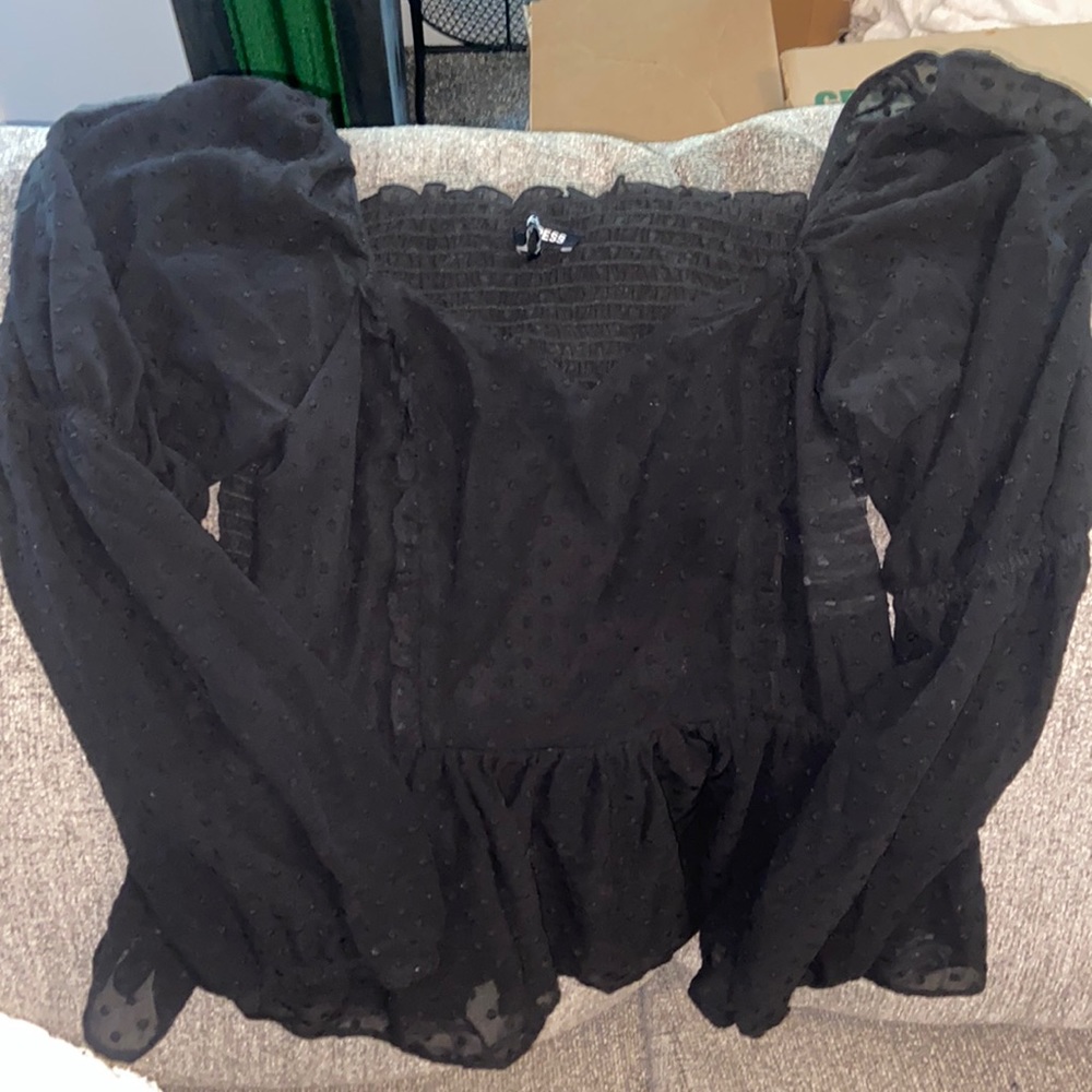 Black express top with cinched waist.